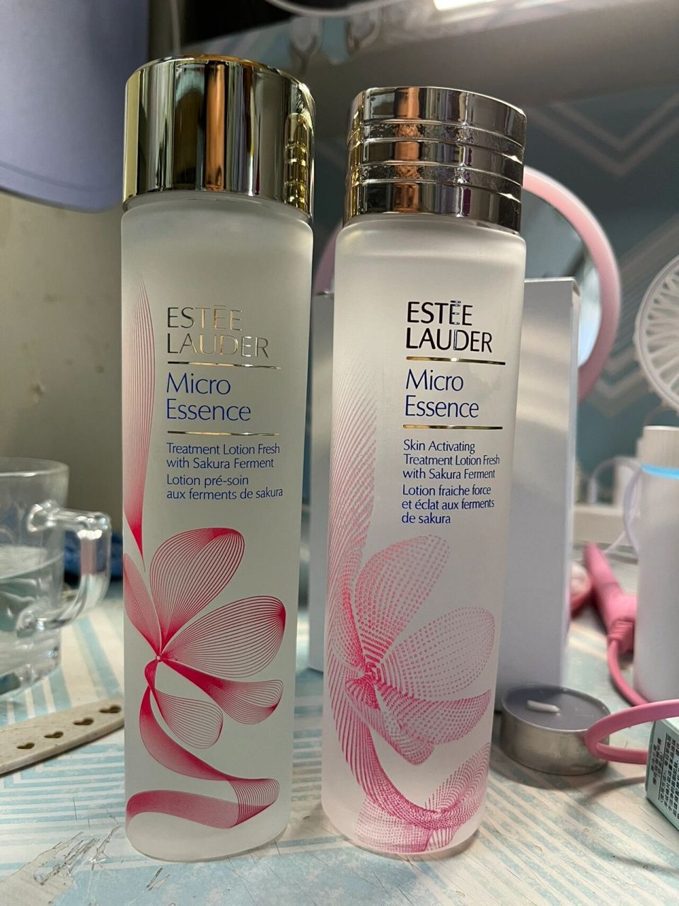 雅诗兰黛樱花水真假辨别   左边是天猫官方旗舰店买的,右边是某代购