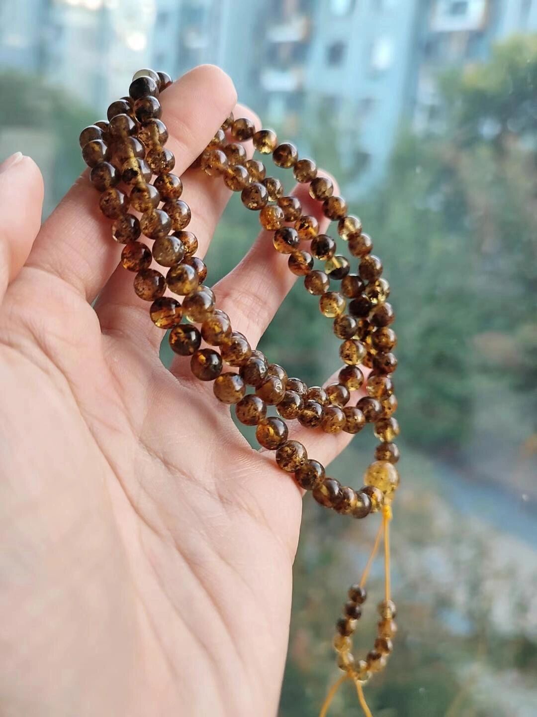 天然植物珀108多圈手串,长短可调节.上手效果非常酷.