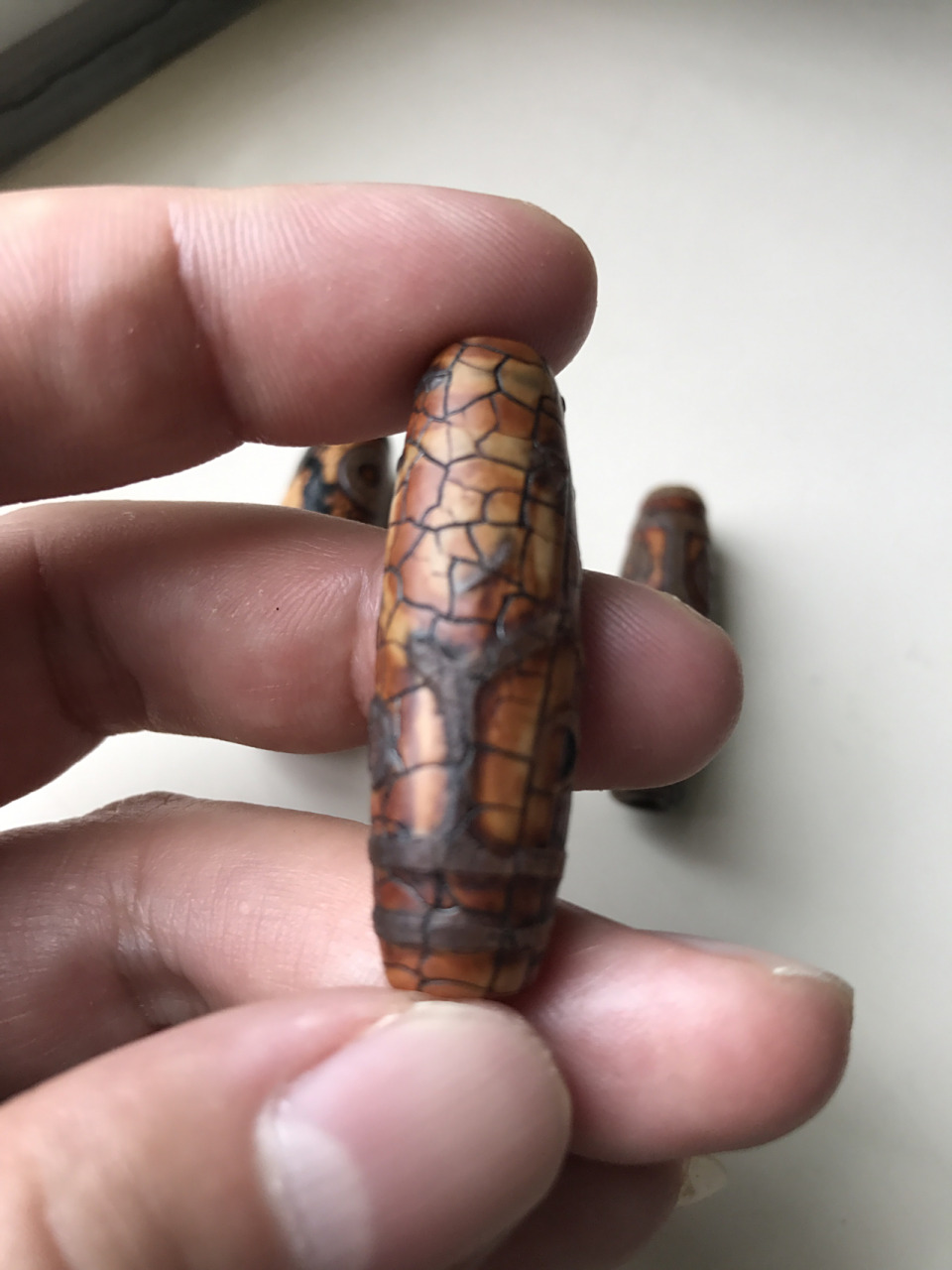 最早的天珠是由海螺化石打磨而成的法螺天珠94后来由于稀缺9015