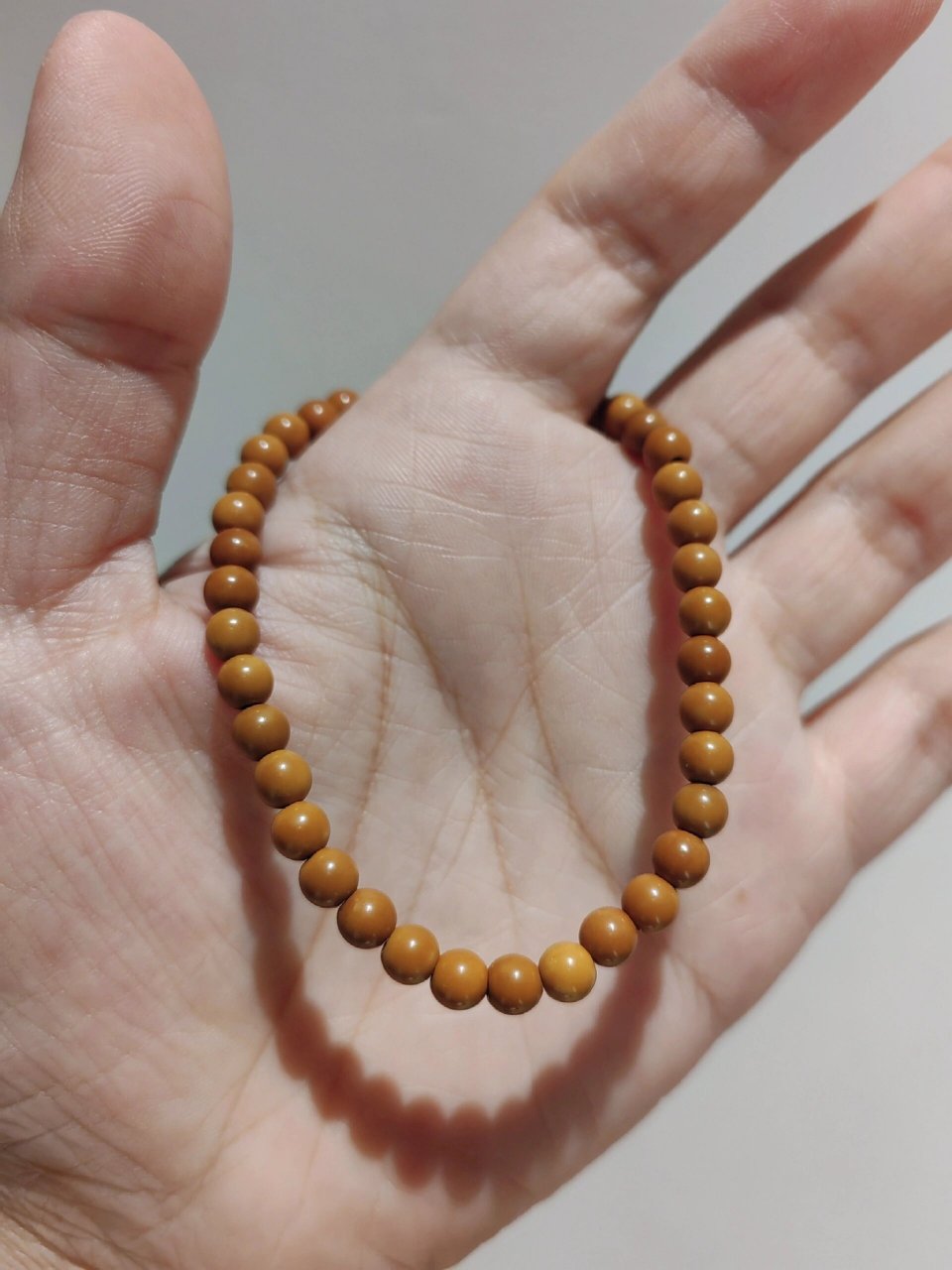 橄榄核尖圆珠素串 这款mini核尖圆珠素串卡5mm,因为是核尖所以每颗