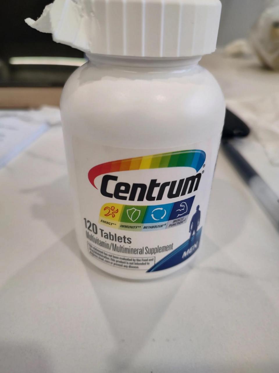 善存(centrum)维生素瓶盖怎么打开 按照这个上面的箭头方向和注明的