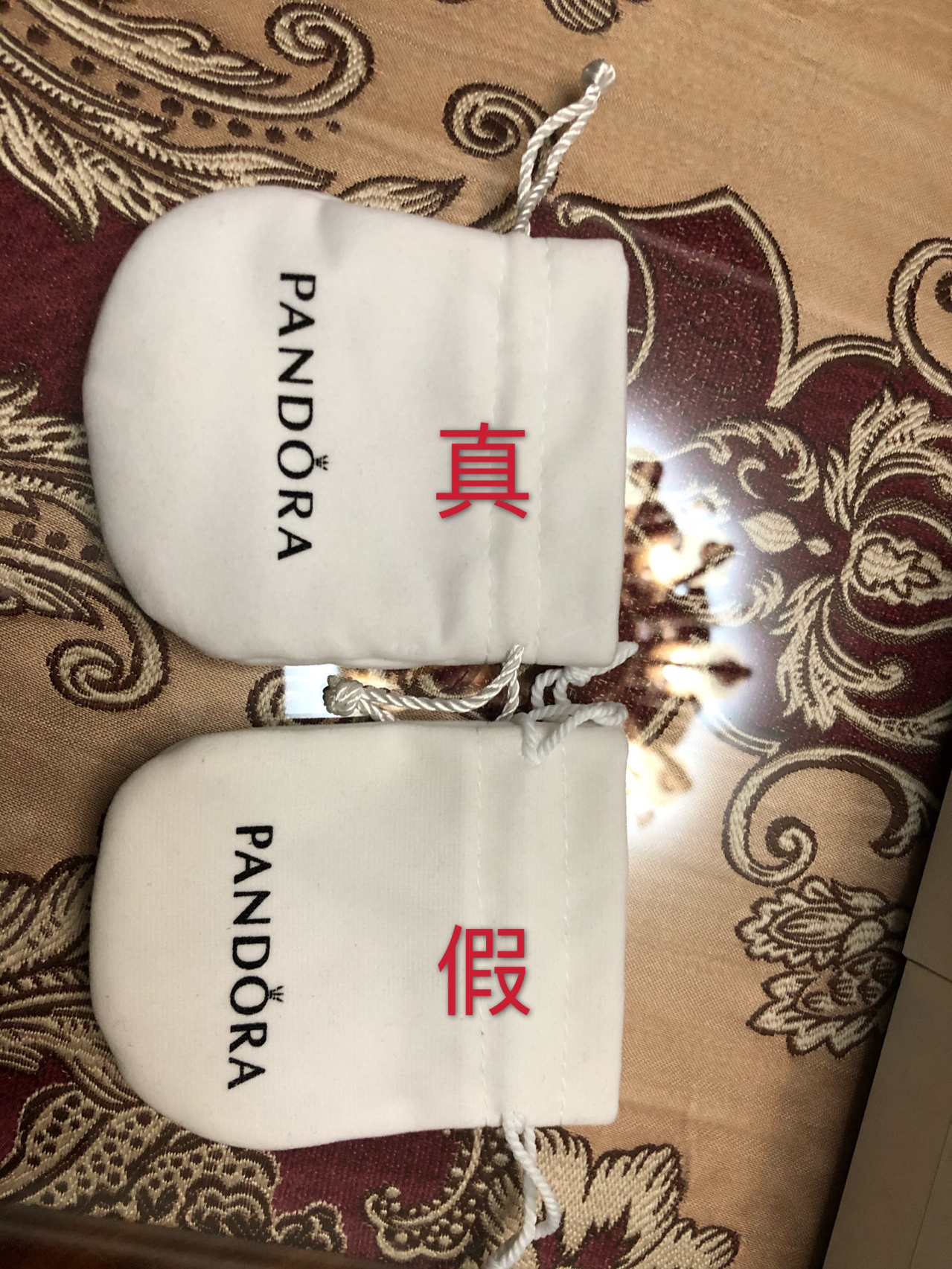 潘多拉手链真假对比 有对比我都看不出来真假,假的是在某宝买的  客服
