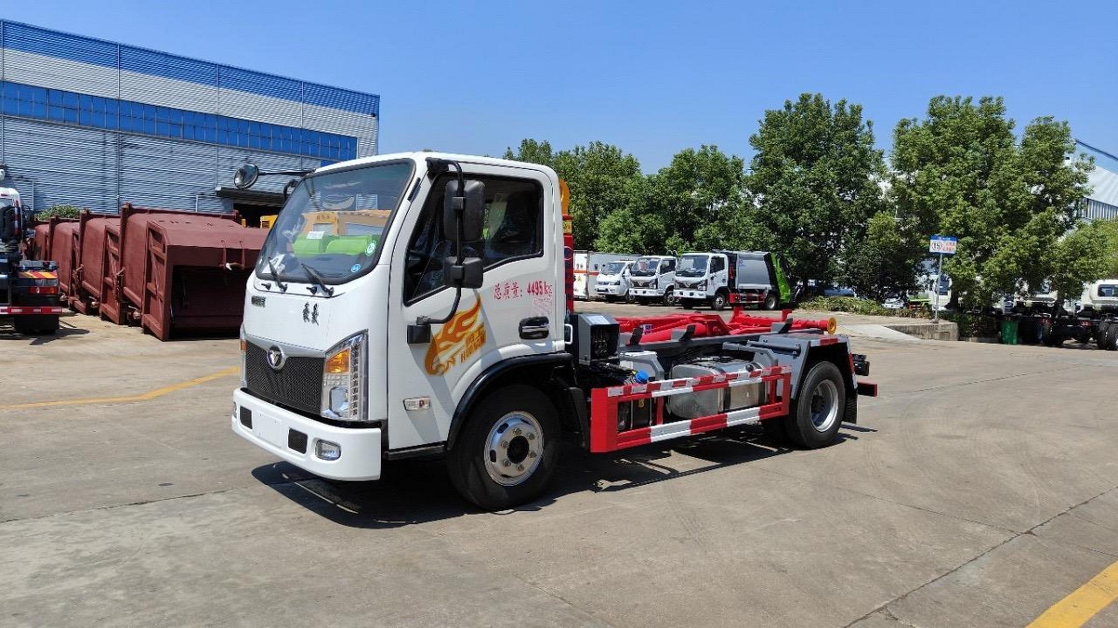 10吨王重汽豪曼蓝牌勾臂车,可以起吊10吨建筑垃圾箱可选液压锁紧!