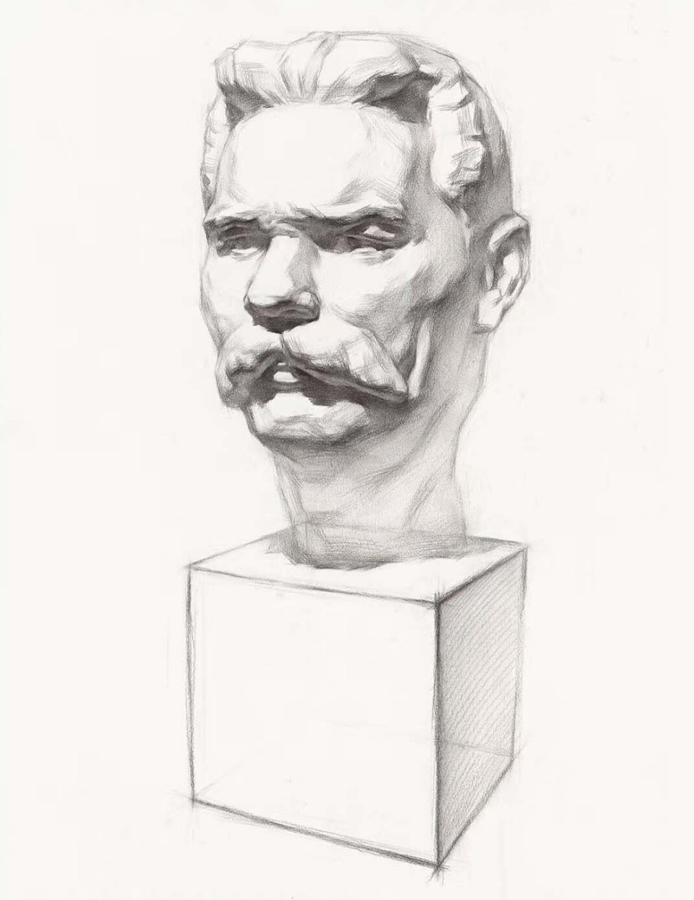 2. 选择一个合适的工作角度,将高尔基石膏头像放置在素描纸旁边.