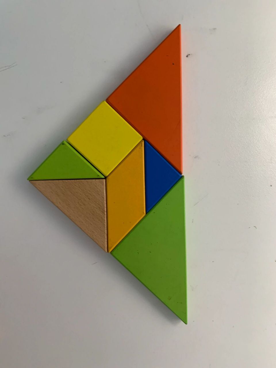 一年级数学下册七巧板之三角形拼摆 用4块拼三角形一共7种可能,图片上