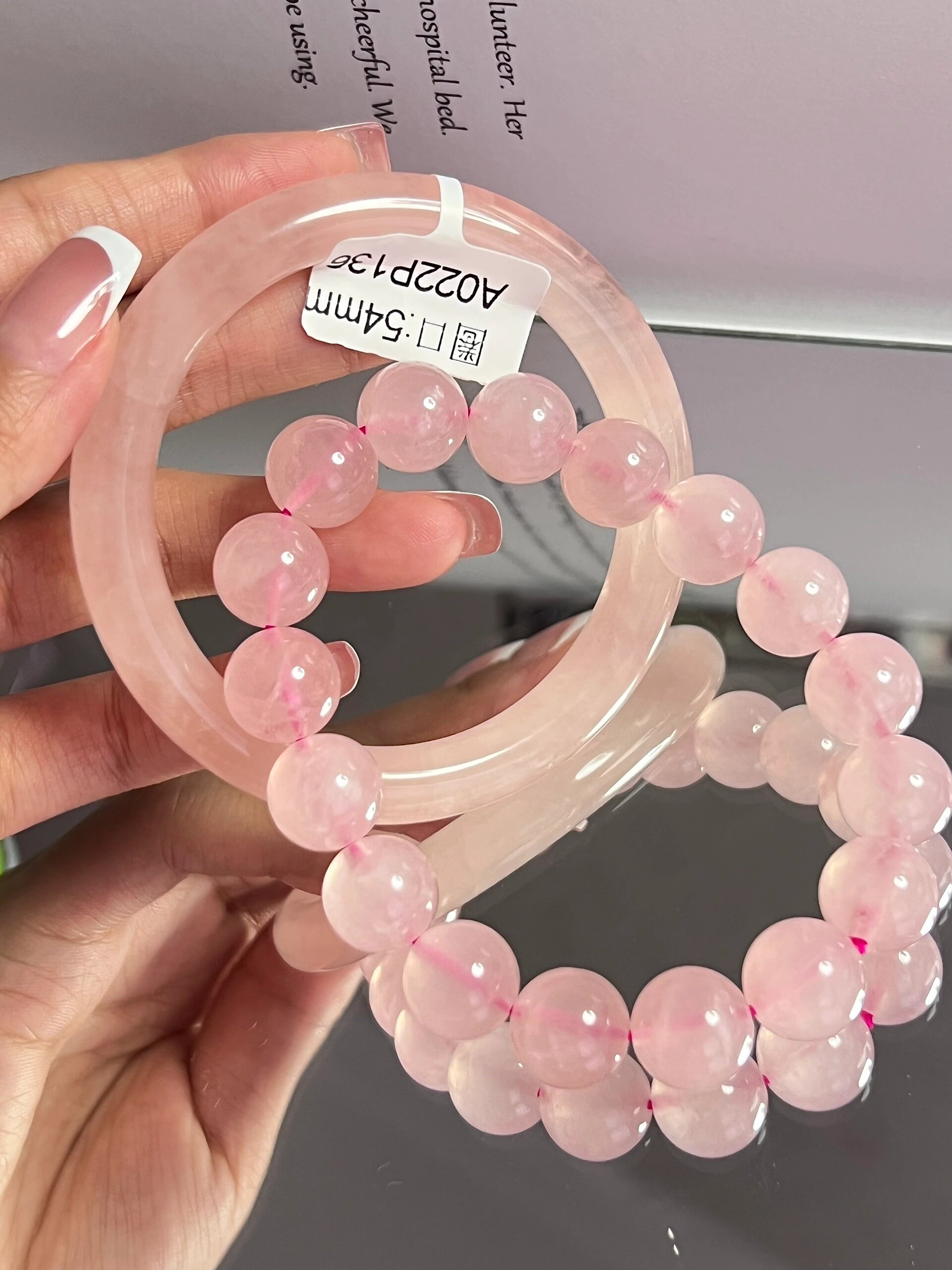 西柚粉水晶54圈口圆条手镯