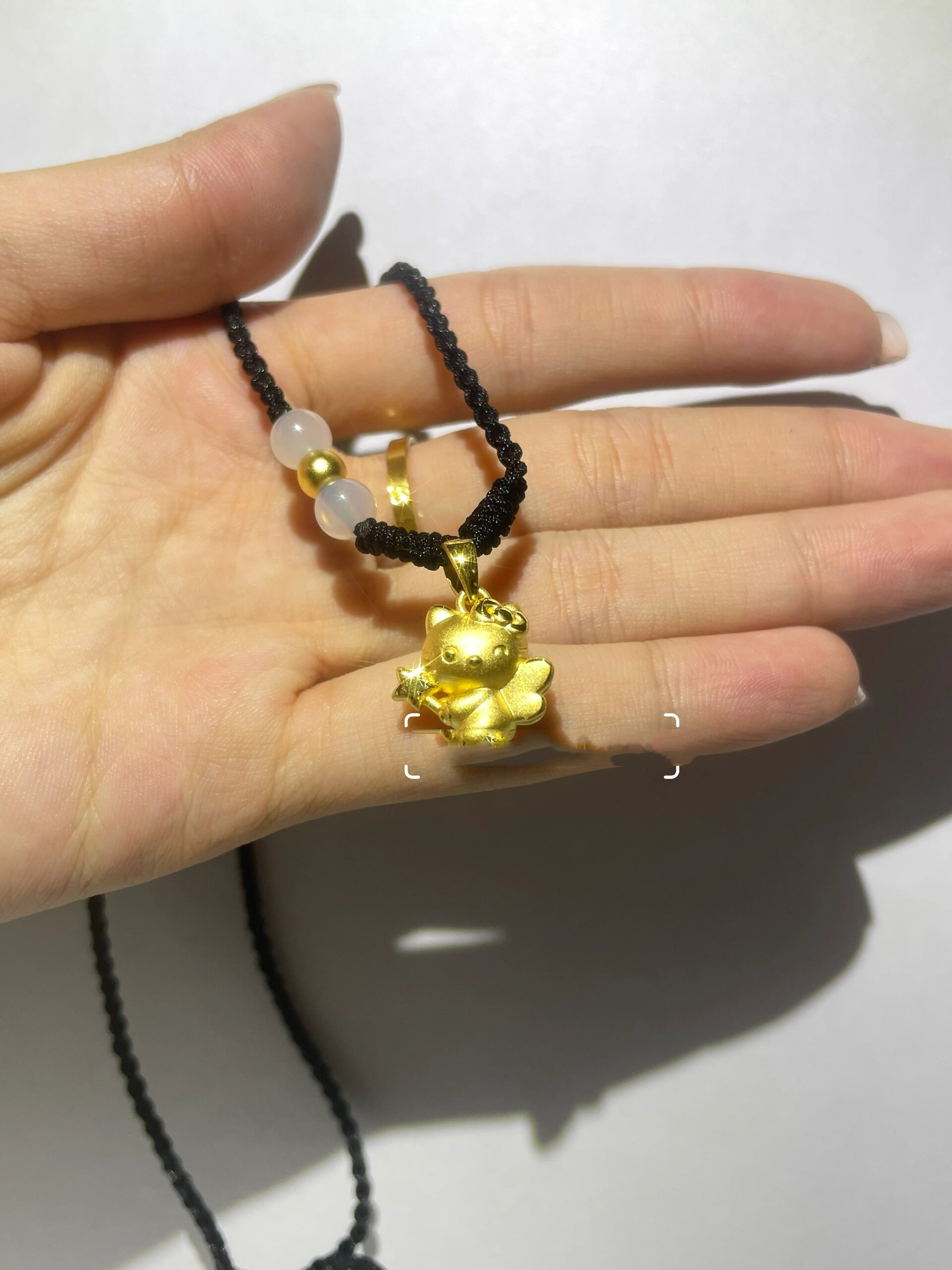 60077小天使kitty足金吊坠编绳项链