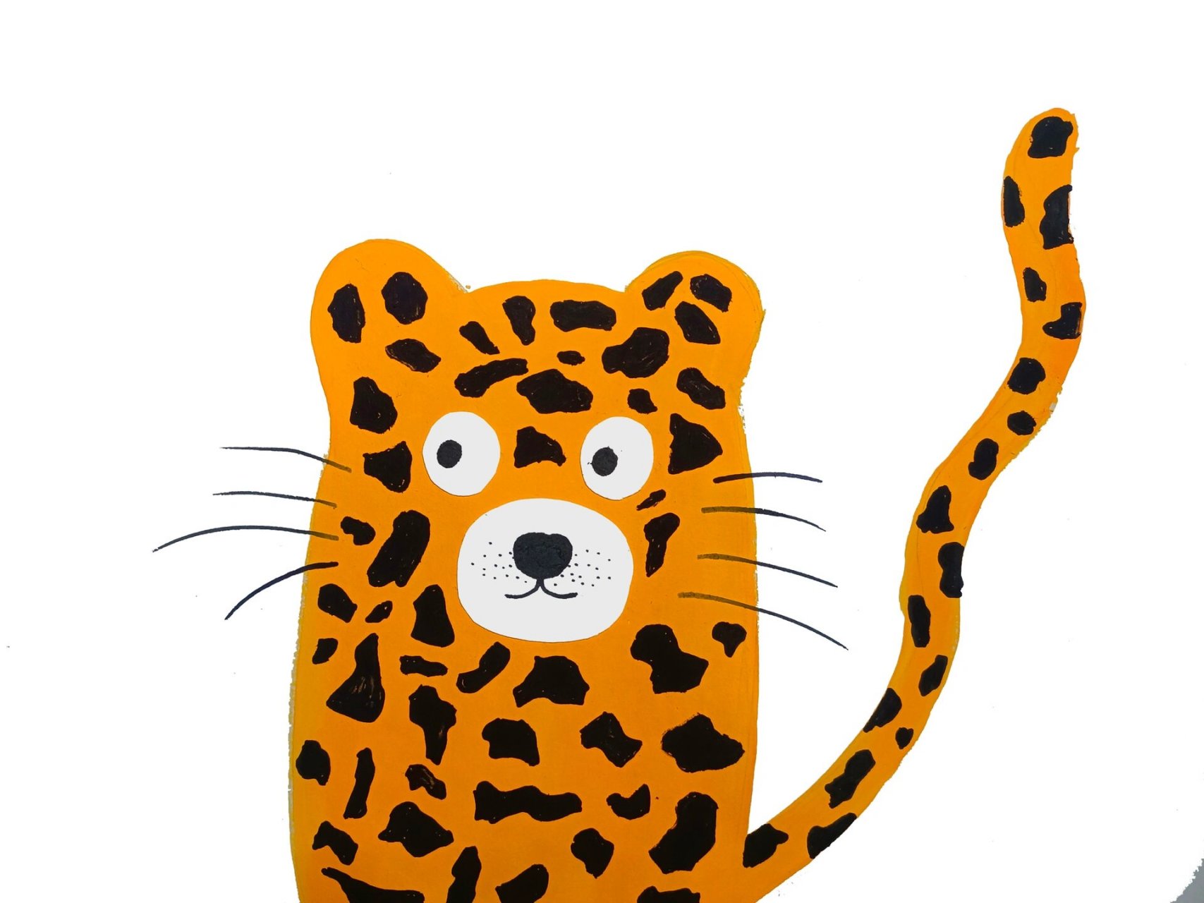 步骤二:用白纸画出花豹眼睛,鼻子,嘴巴并剪下来贴上去.