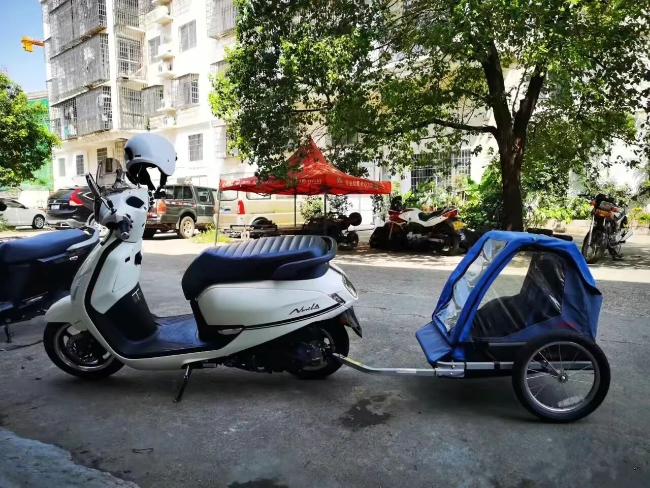 这是样的摩托车后面挂个小拖车,合不合规?