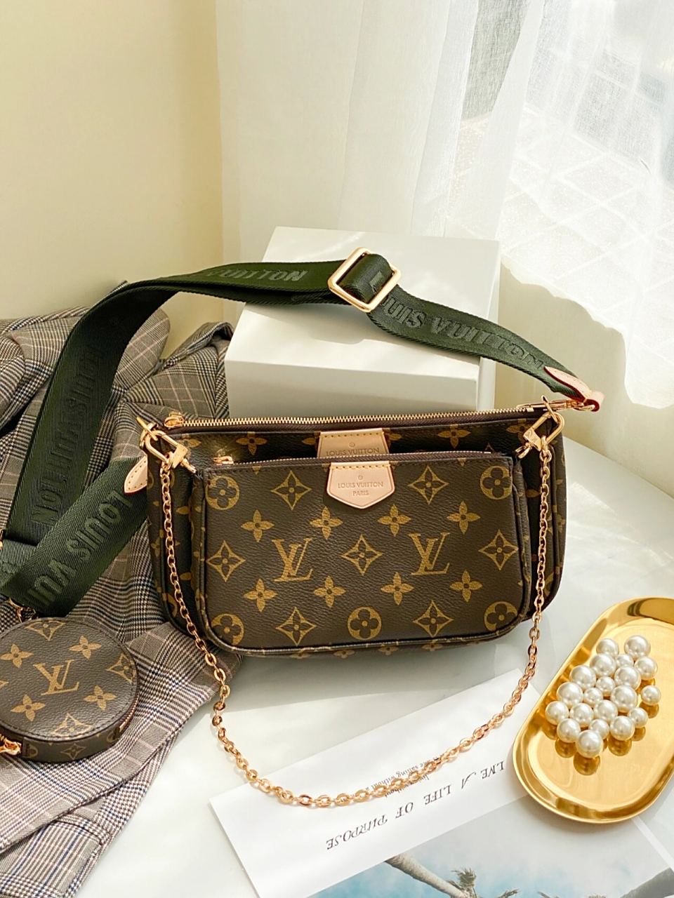 pochette accessorise手袋,被称为lv三合一麻将包; | 92这款包包