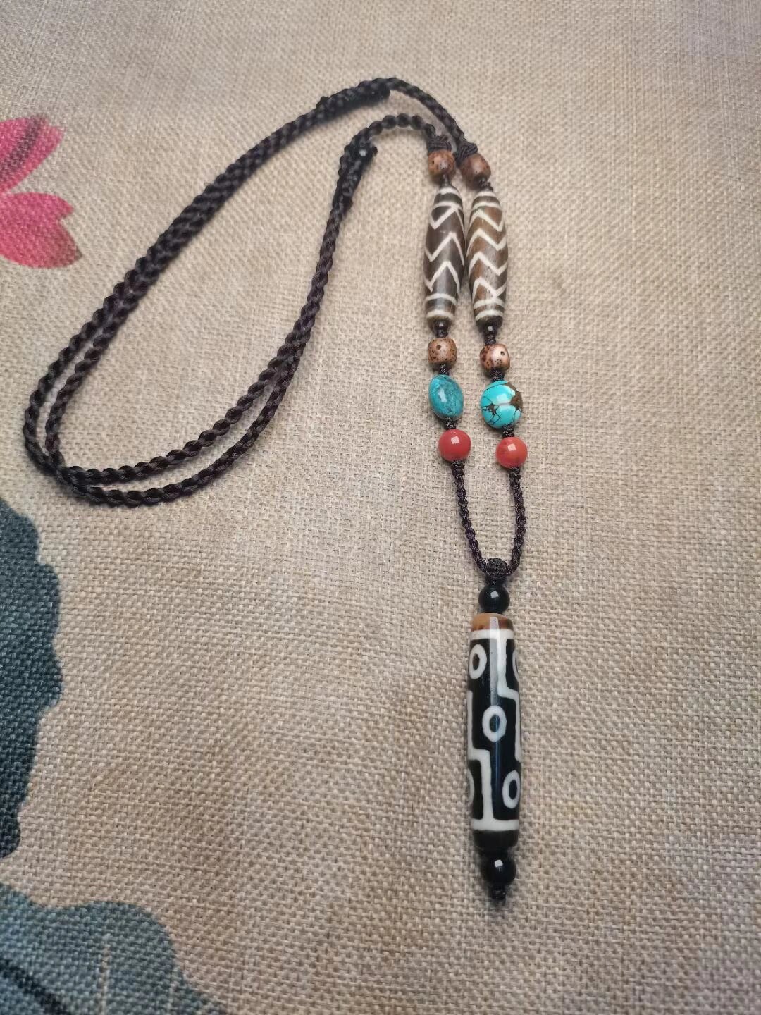 当藏传天珠碰到红肉九眼,该怎么选?