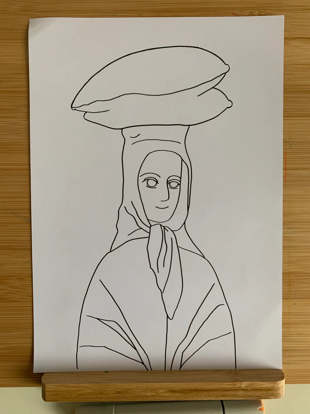 世界名画 头顶面包的女子 这一幅画是毕加索的名画,这个时候的毕加索