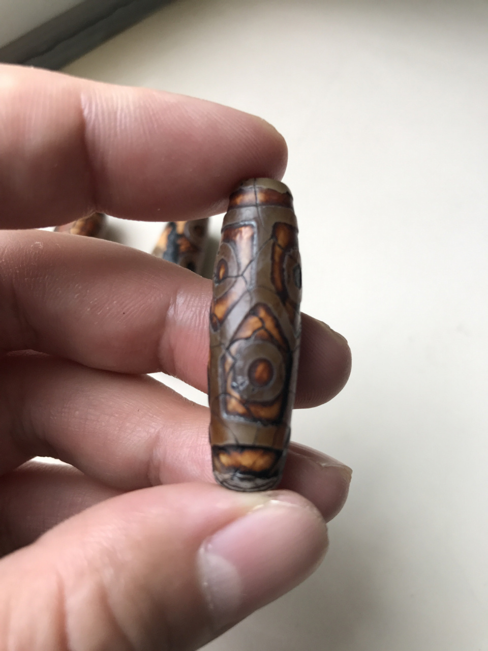 最早的天珠是由海螺化石打磨而成的法螺天珠94后来由于稀缺9015