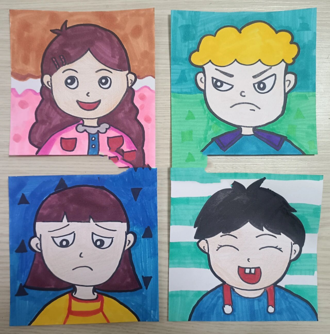 创意美术《表情——喜怒哀乐》儿童画 1,工具材料: 卡纸,马克笔,勾线