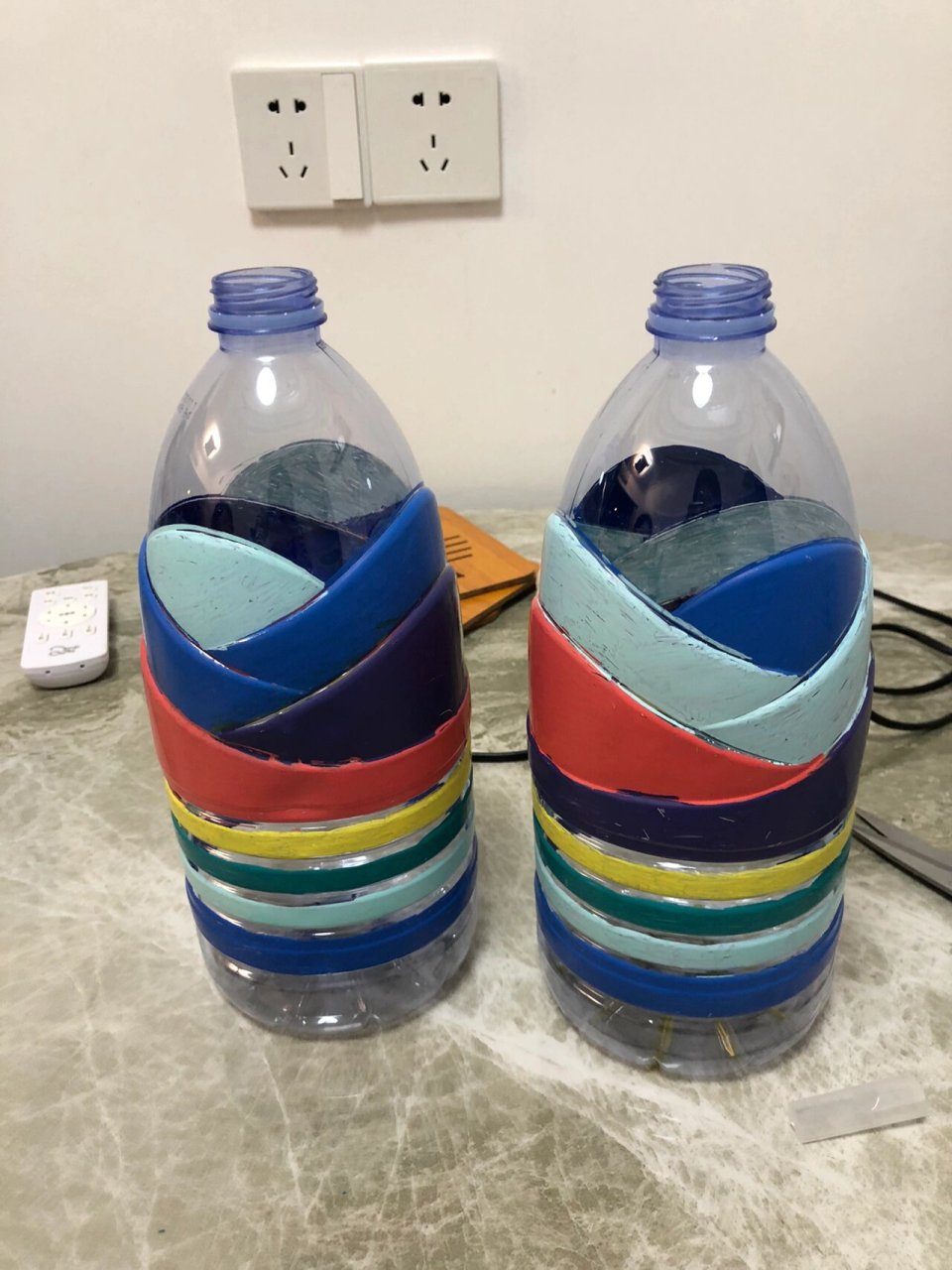 幼儿园废物手工～瓶子体育运动器械 周末老师布置作业:要求用瓶水做