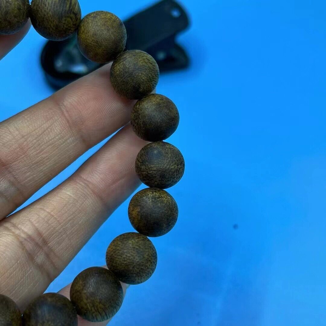 9分沉海南紫奇楠沉香手串 规格:10mm19颗9.1克 简述:海南紫奇楠9.