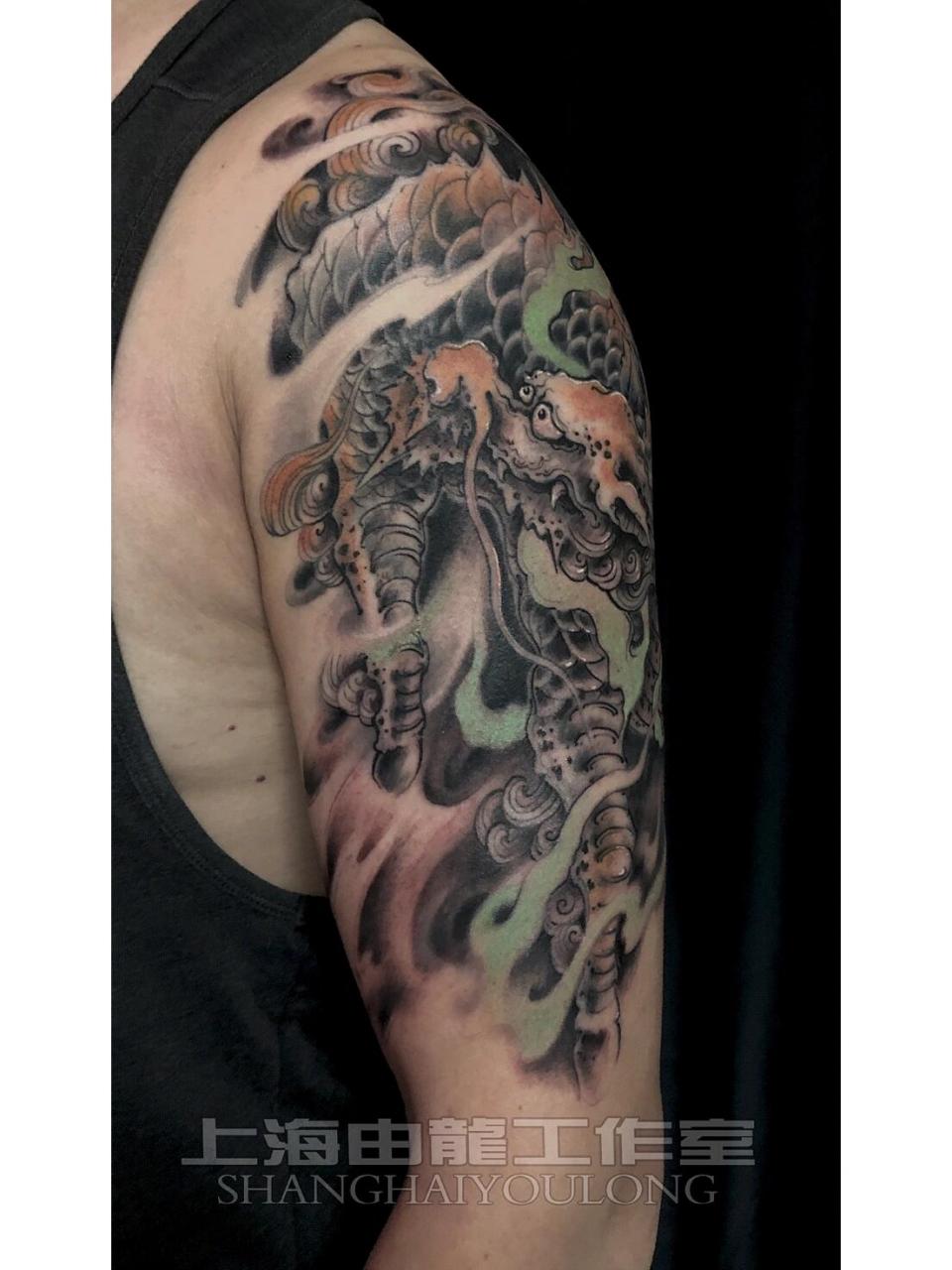 大臂瑞兽麒麟纹身