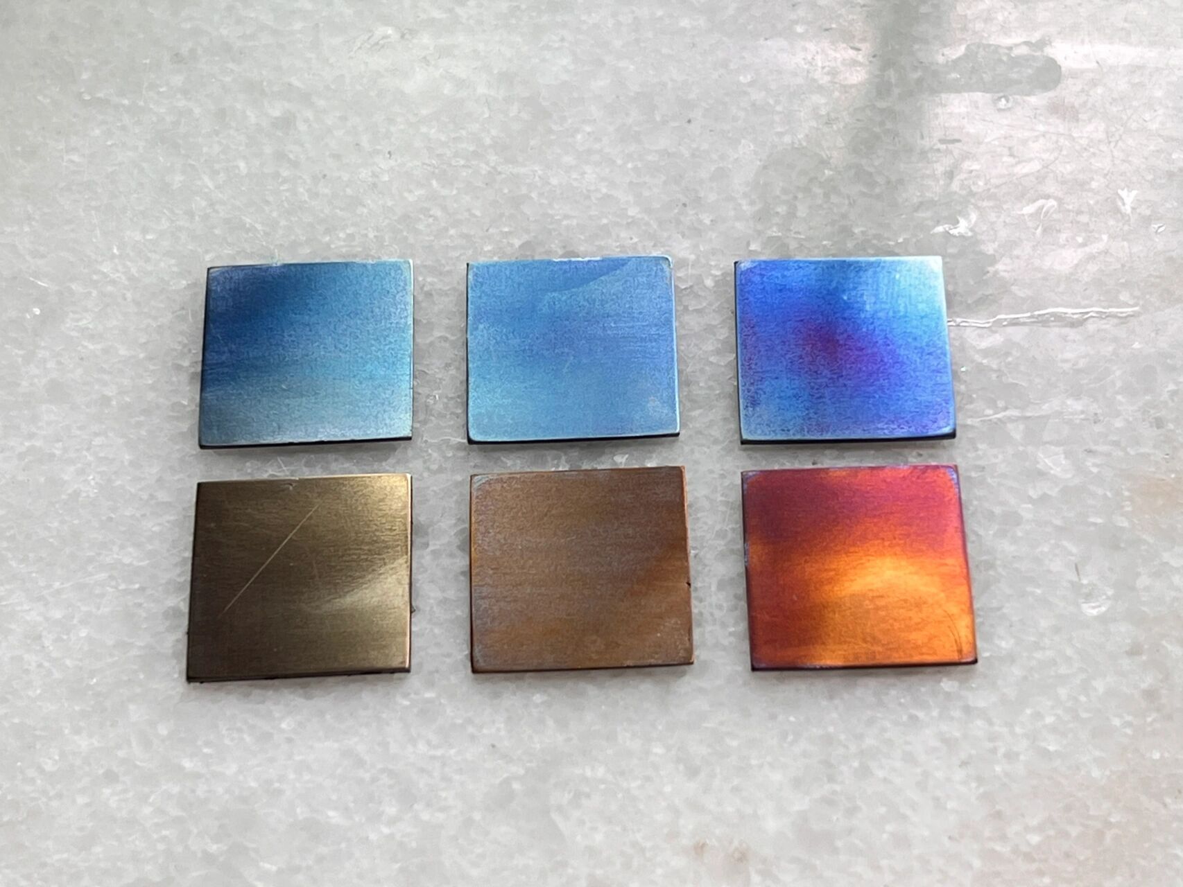 金属钛的颜色变化 金属钛 着色实验 很喜欢左上三角形的青色 还有中间