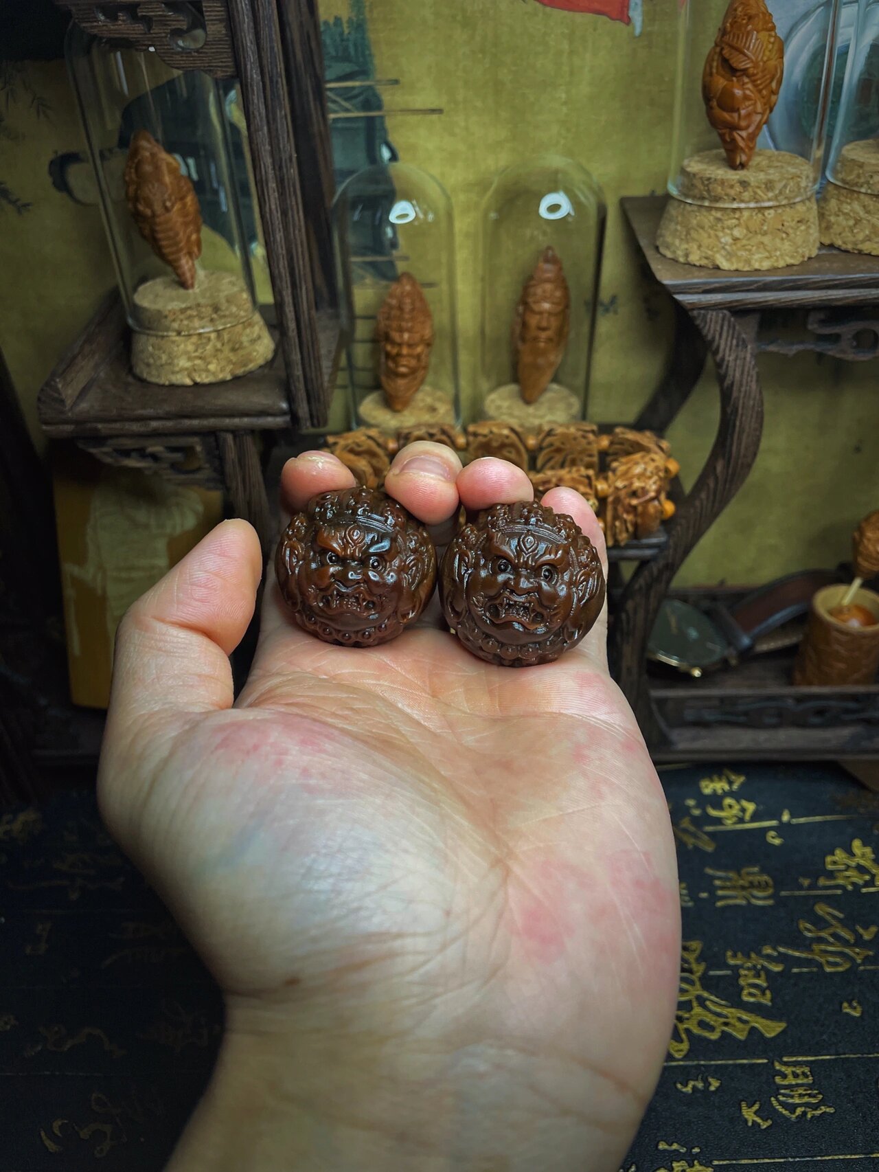 128巴西橄榄核手球玉化大黑天一对 滴溜圆