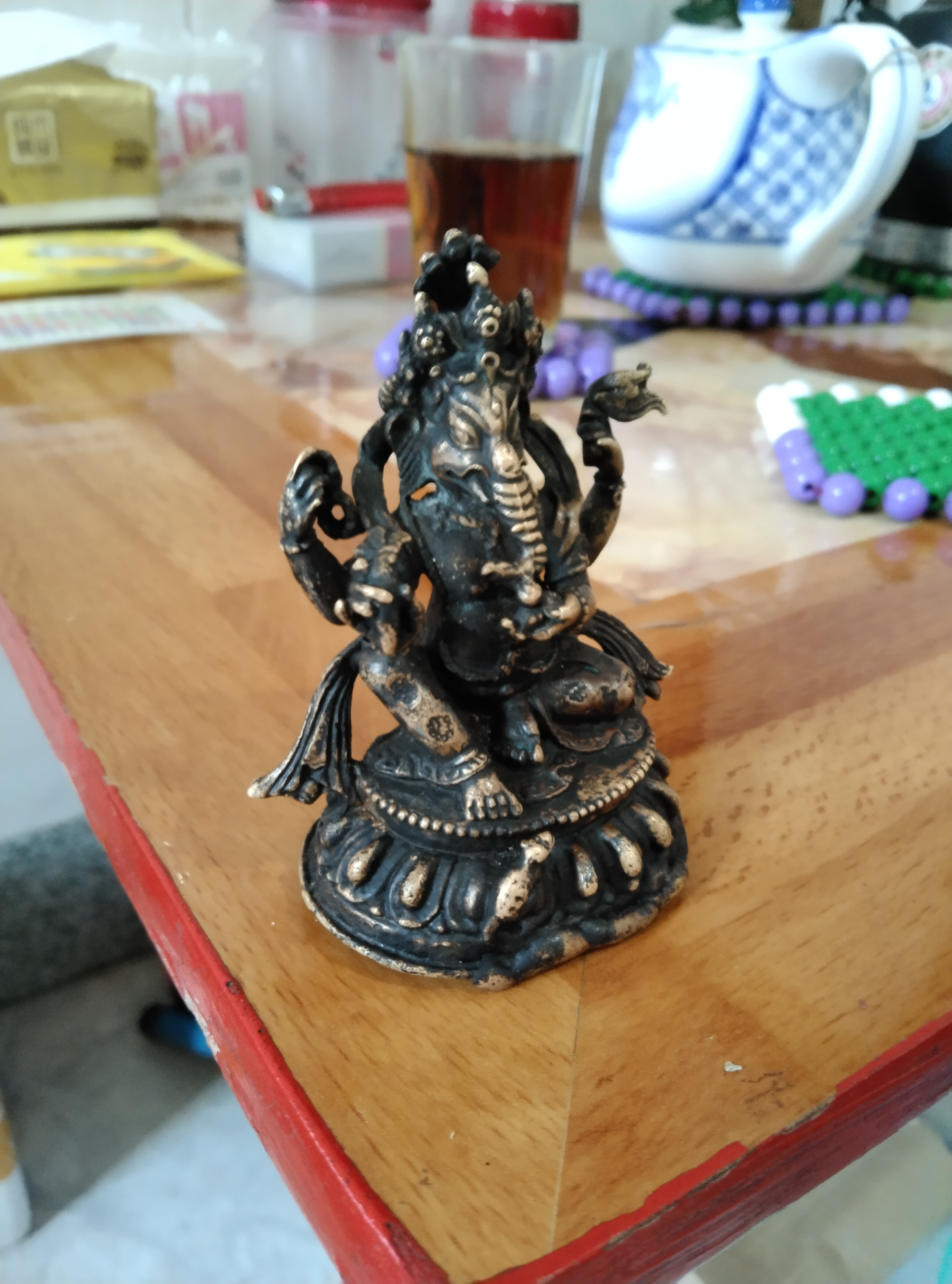 藏传四臂象神财神座像;材质:金铜,法相通体包浆黑漆古,内膛皮壳:朱砂