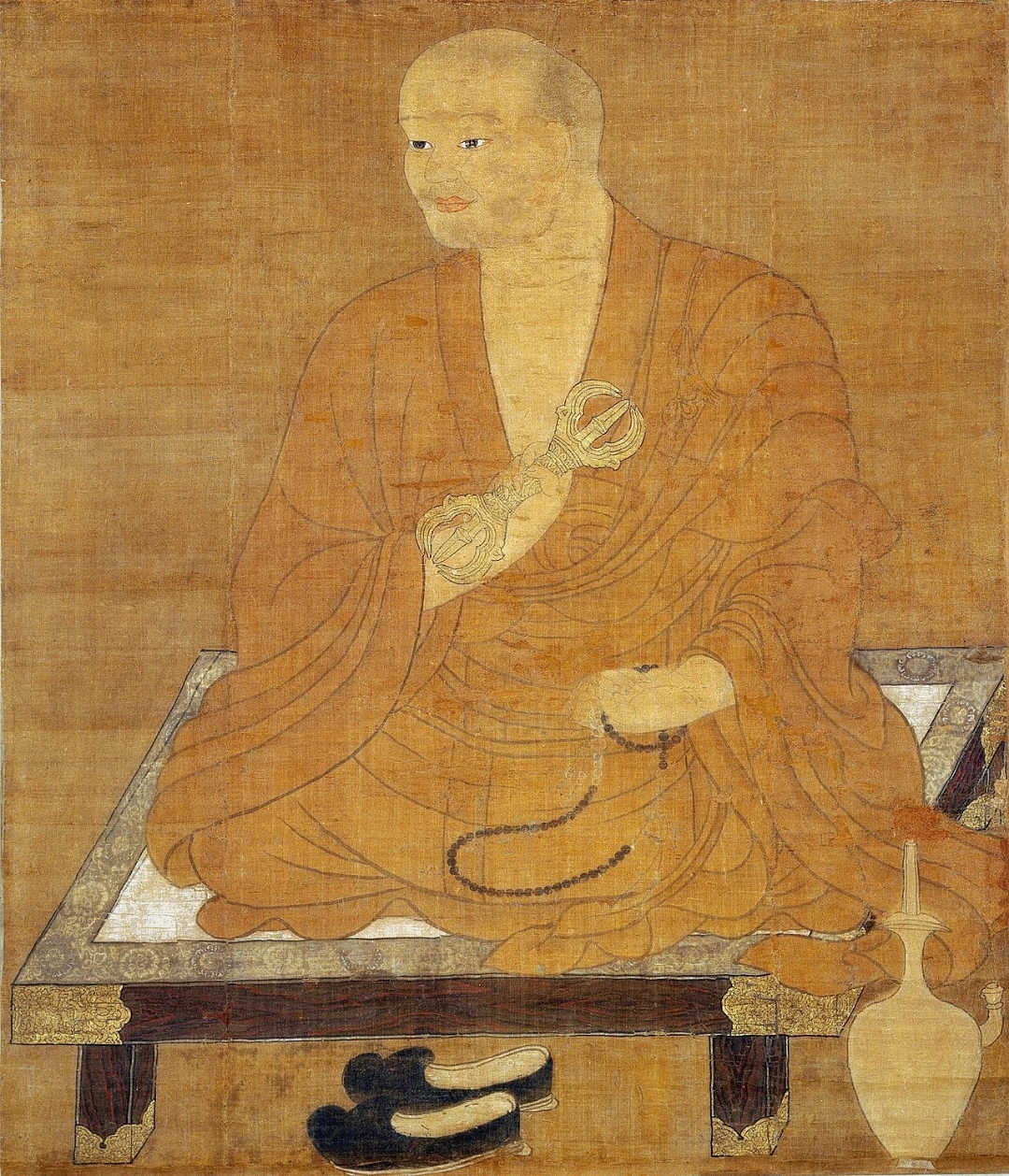 这幅画描绘了一个宁静的场景:一位僧人在蒲团上打坐,手持禅珠,显得