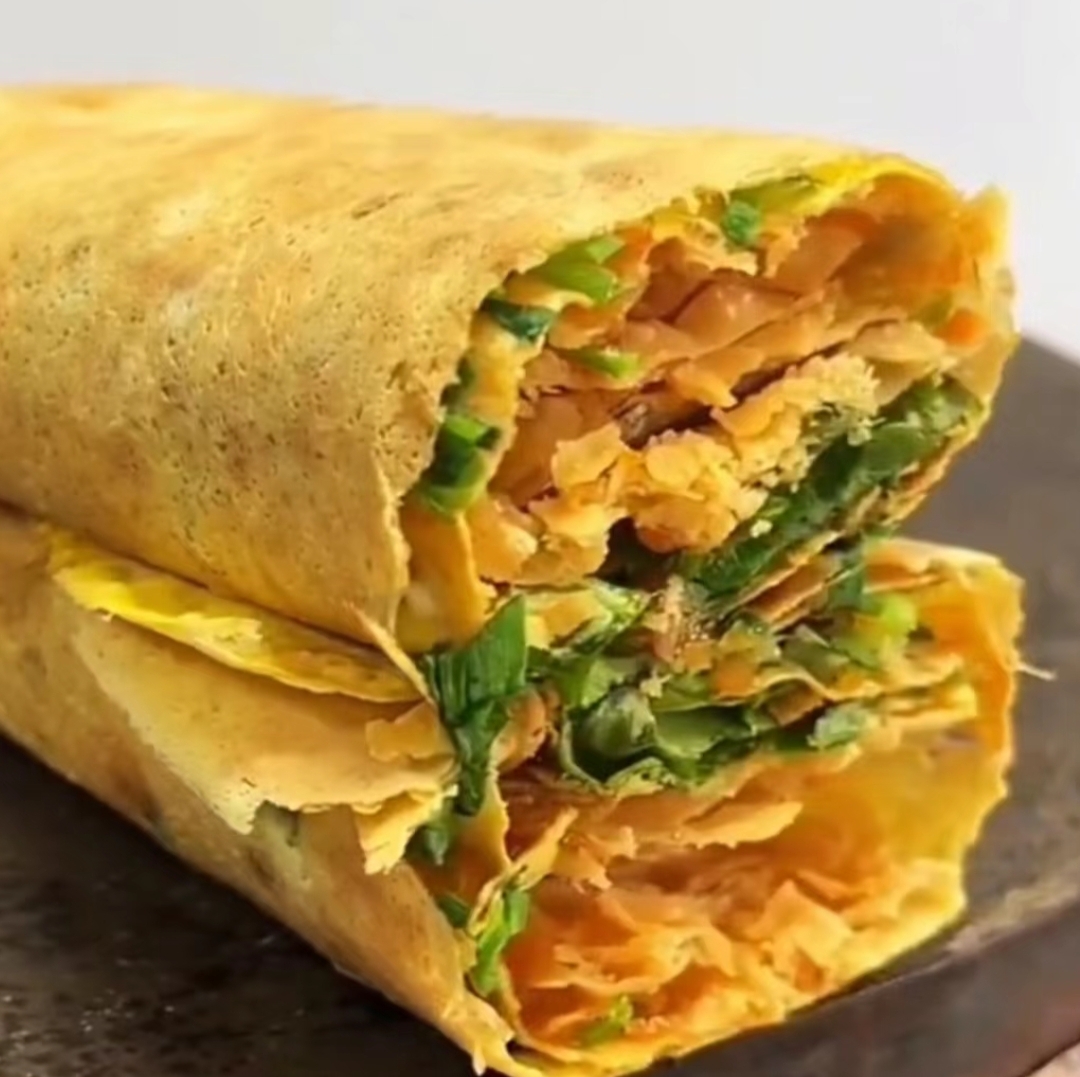 深刻并且一直念念不忘的那肯定是开在我们学校小吃街的山东杂粮煎饼