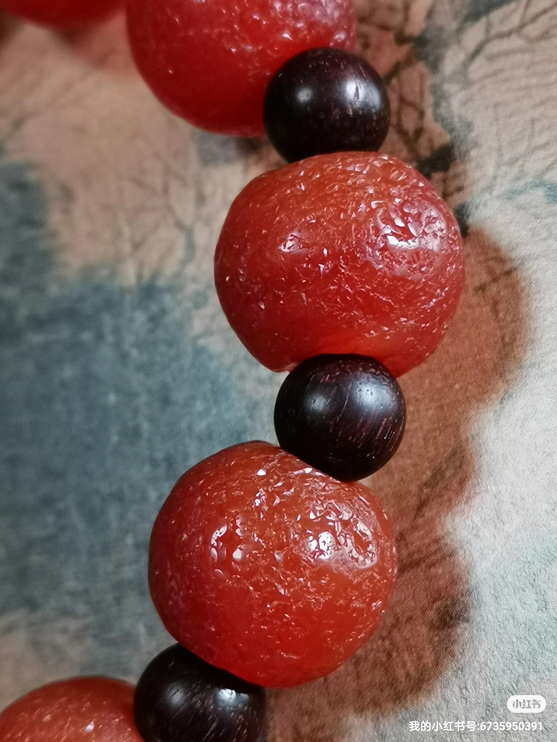 千年迭部南红玛瑙手串 这串千年迭部南红玛瑙手串共由十一颗锦红珠子