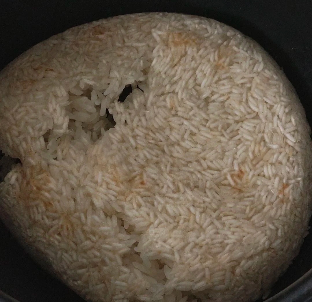 妈见打,煮饭忘记加水了!