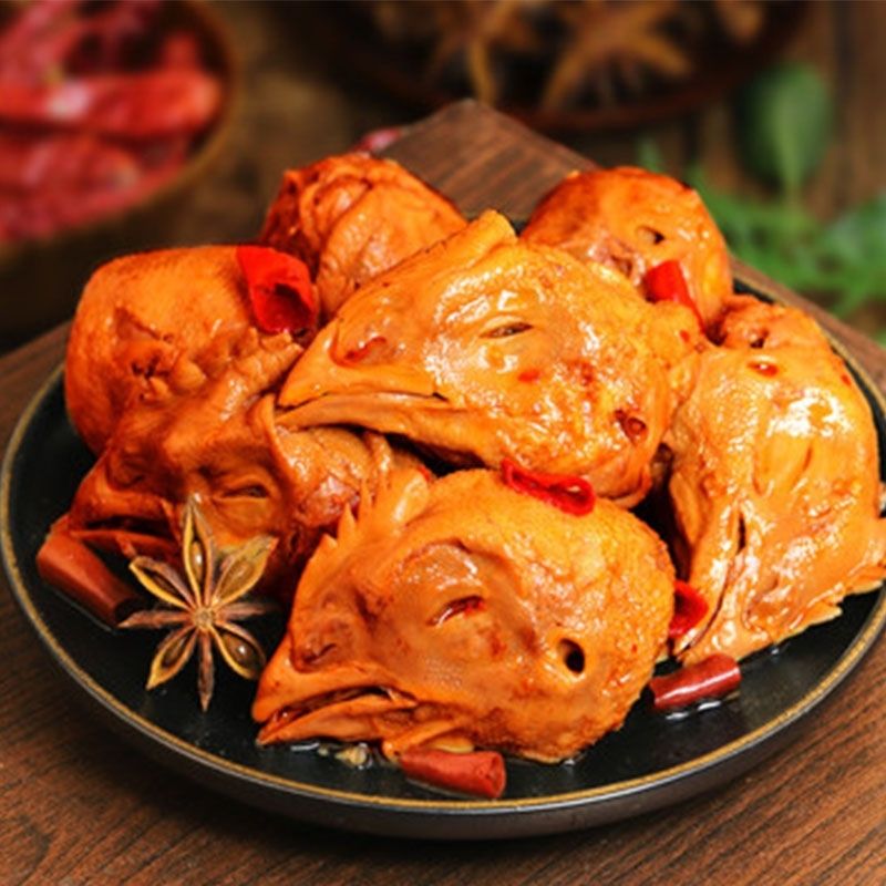 卤香四溢满街头, 味美鸡头引客留. 麻辣鲜香齐入口, 人间至味此中 ..