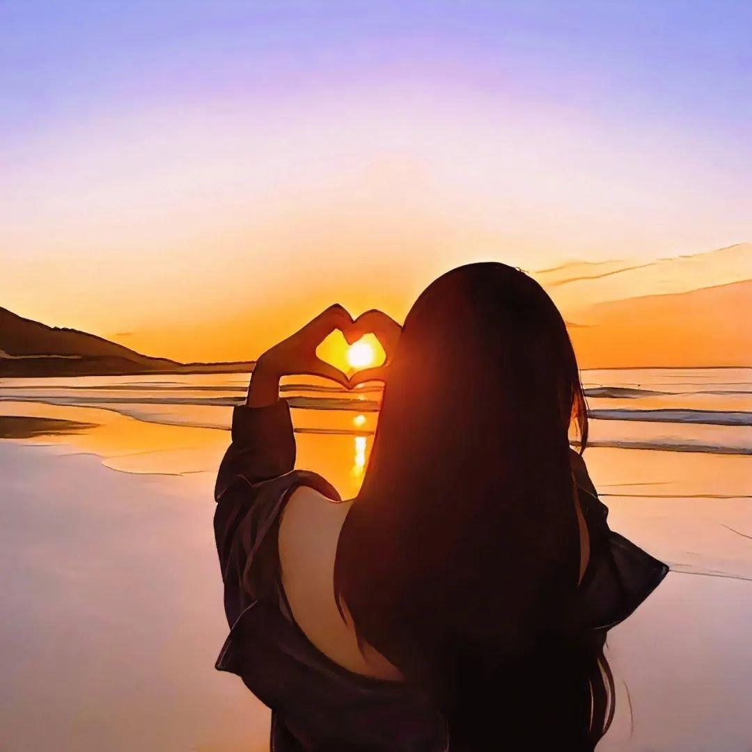 春节假期,海边夕阳,心形手势,浪漫无限.#春节去哪玩