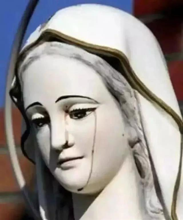 世界十大未解之迷 第八个未解之迷:流泪的圣母像 澳洲一位中年妇女从